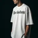 a-man-wearing-over-sized-tshirt-white-colour-showi.webp