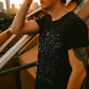 male-model-in-a-plain-black-t-shirt-on-a-rooftop-d.webp