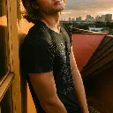 male-model-in-a-plain-black-t-shirt-on-a-rooftop-d (3).webp